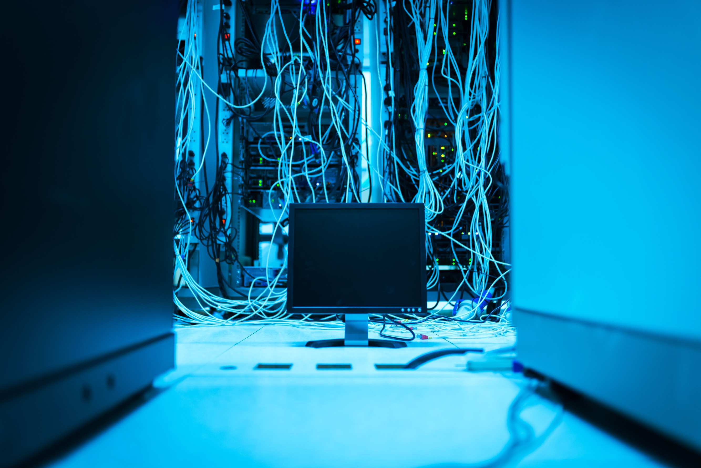 Cloud infrastructure visualization on displays with monitor and cables in a data center